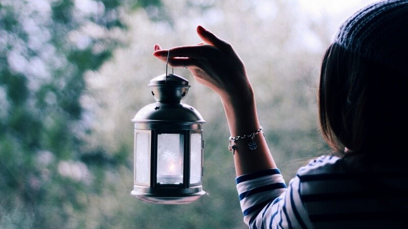 Person Holding Lantern — Gray