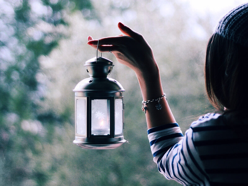 Person Holding Lantern — White