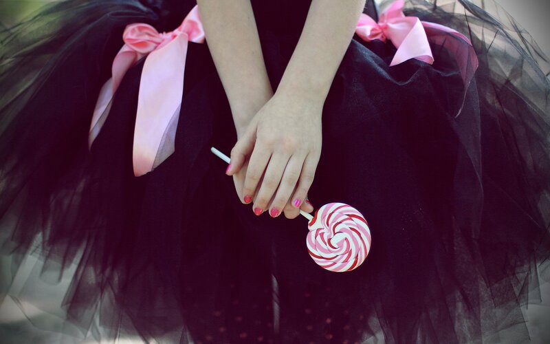 Person Holding Lollipop — Black