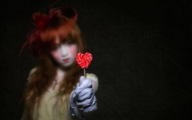 Person Holding Lollipop