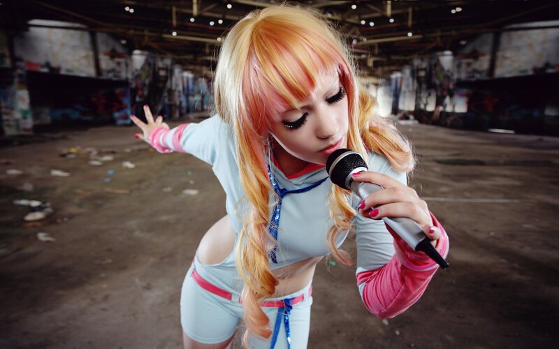 Person Holding Microphone — Blonde, Dramatic