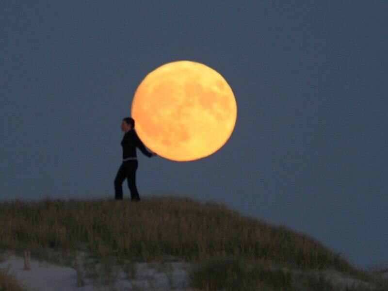 Person Holding Moon