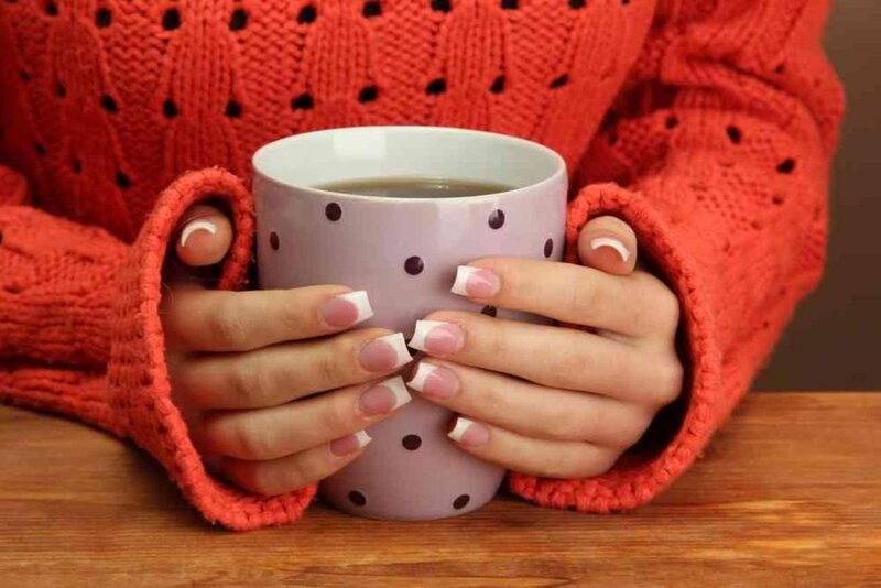 Person Holding Mug — Red