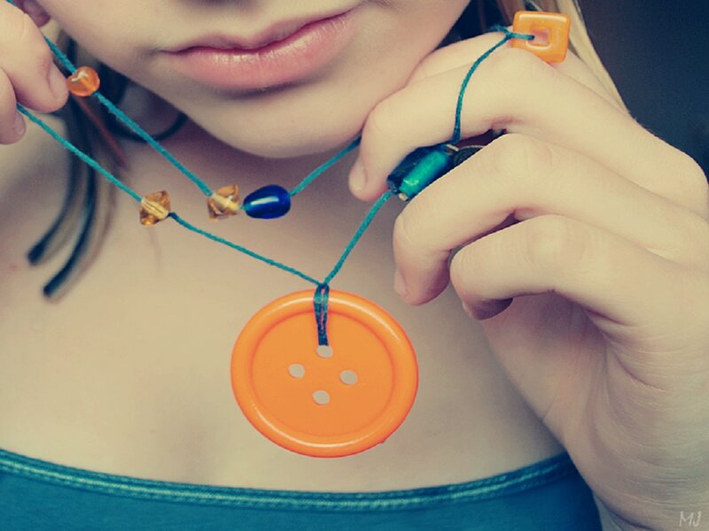 Person Holding Necklace