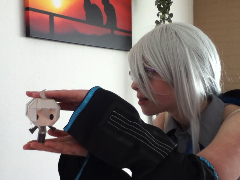 Person Holding Paper Figure