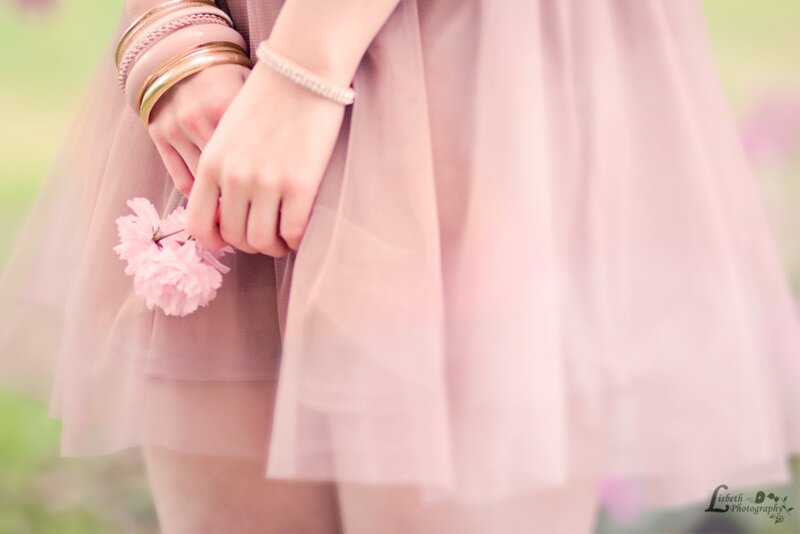 Person Holding Pink Flower