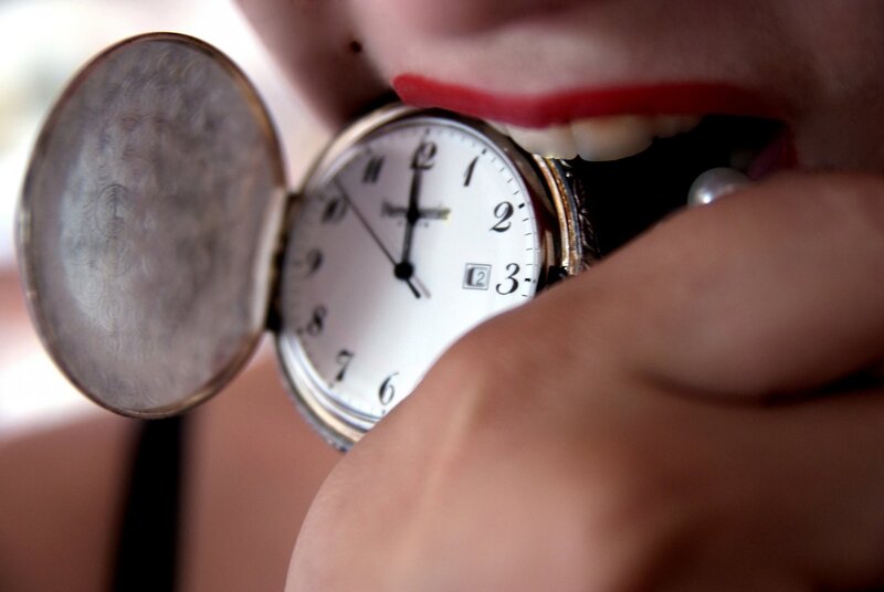 person holding pocket watch