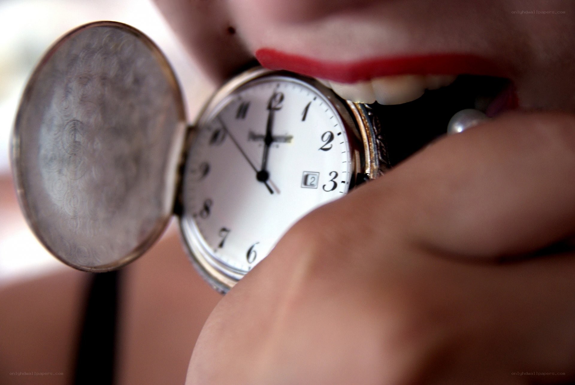person holding pocket watch