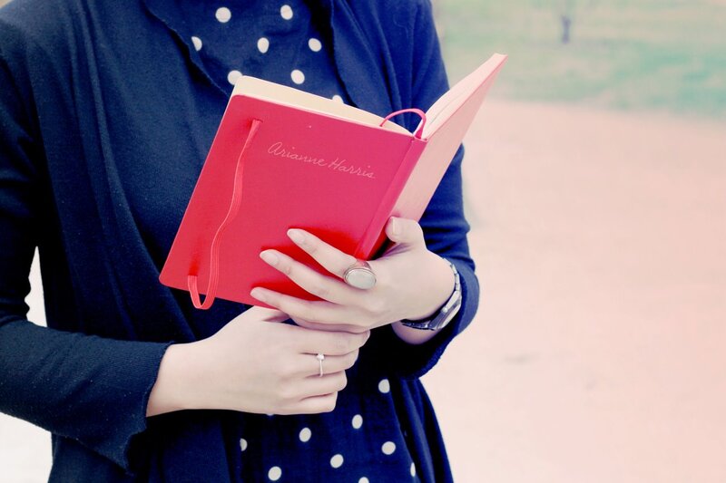 Person Holding Red Book