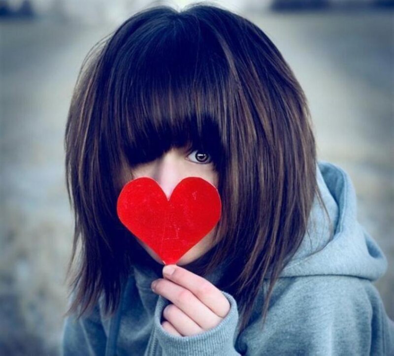 Person Holding Red Heart — Playful