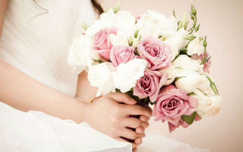 Person Holding Rose Bouquet