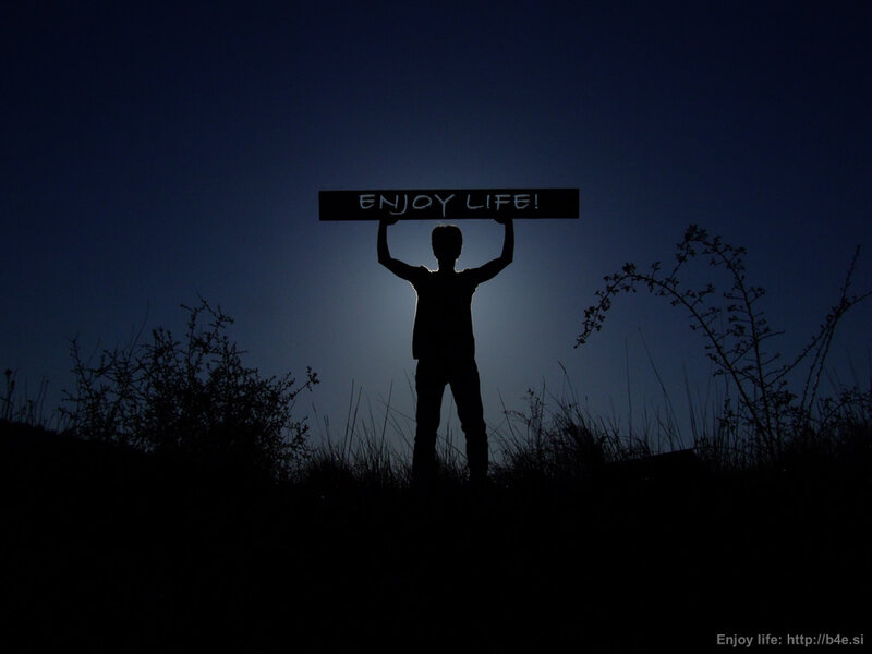 Person holding sign at night