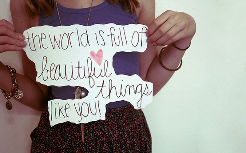 Person Holding Sign — Purple