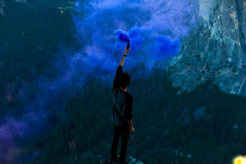 Person Holding Smoke Flare
