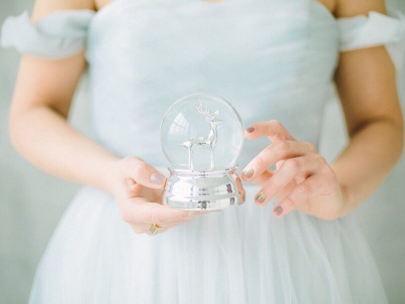 Person Holding Snow Globe