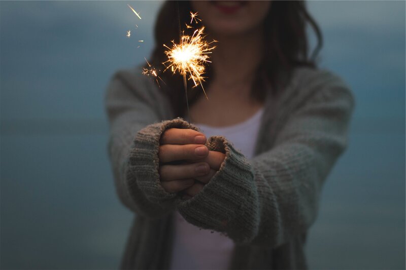 person holding sparkler