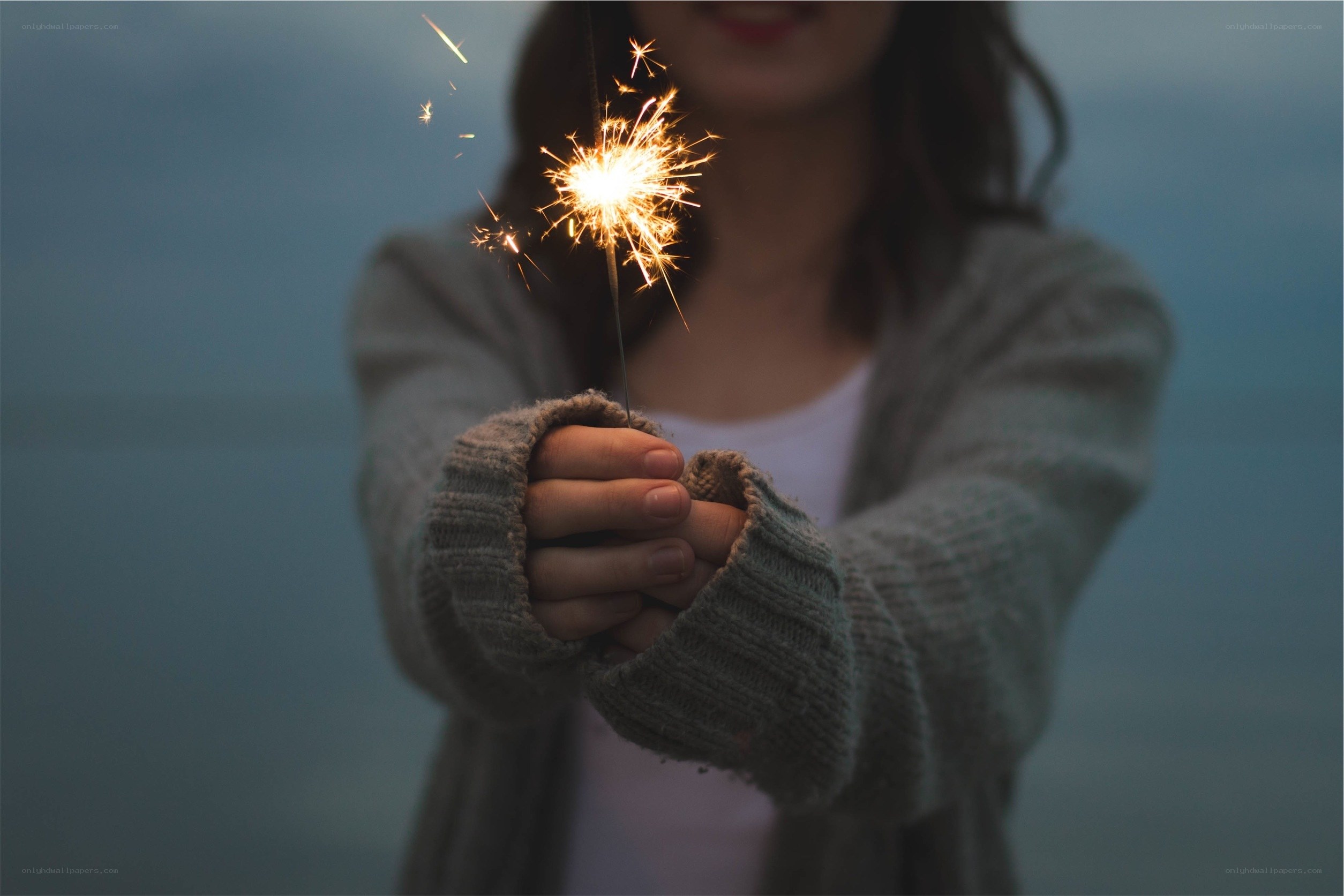 person holding sparkler