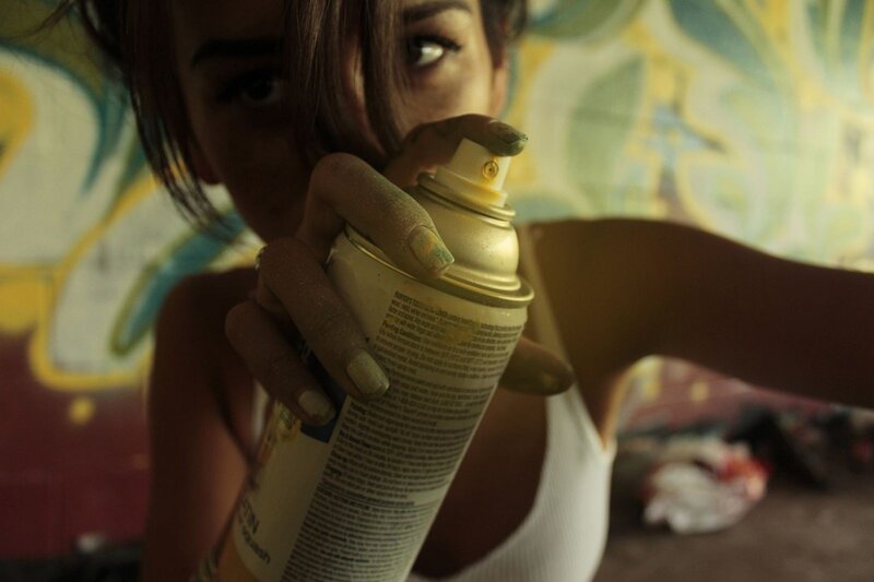 person holding spray can