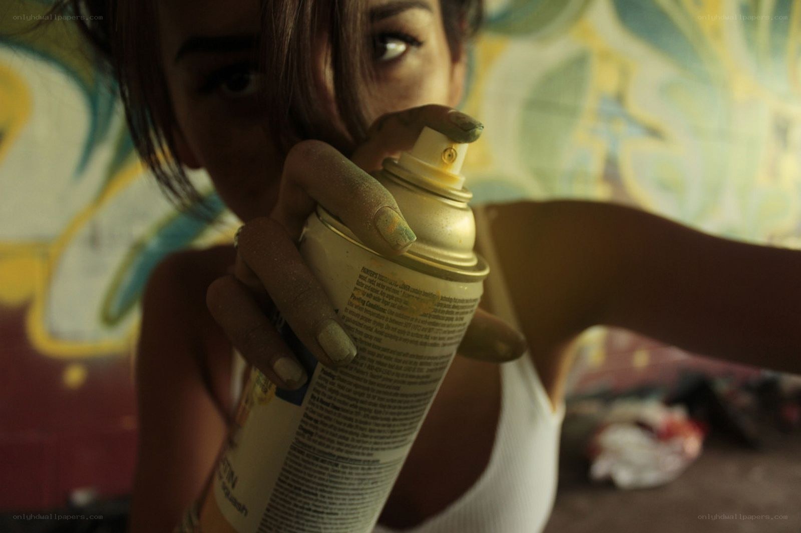 person holding spray can