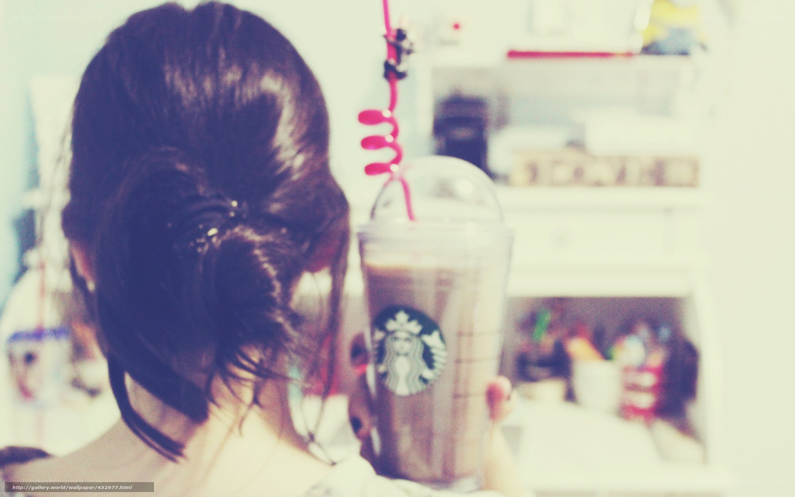 person holding starbucks drink