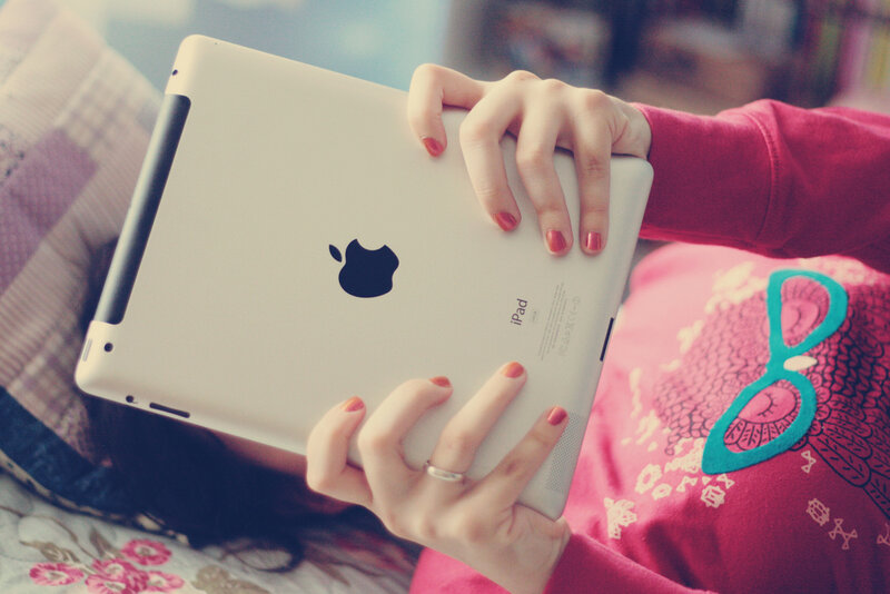 Person Holding Tablet