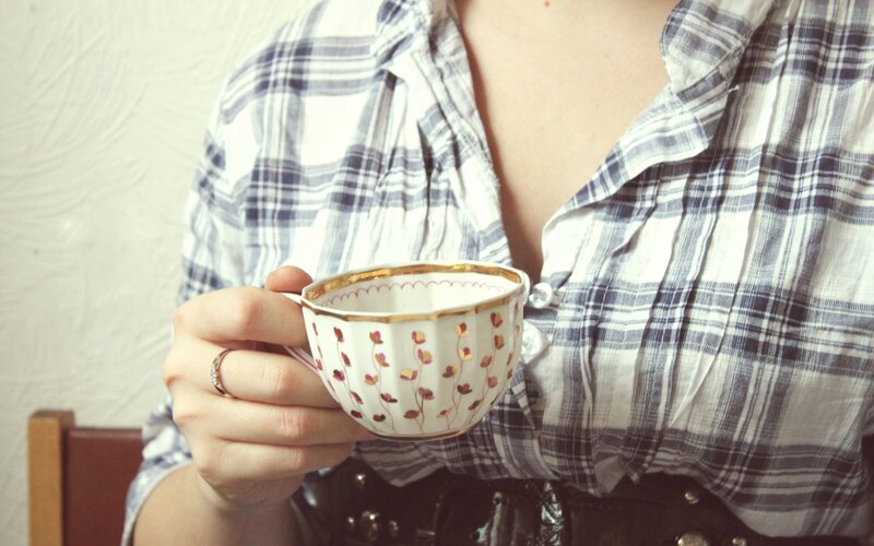 Person Holding Teacup