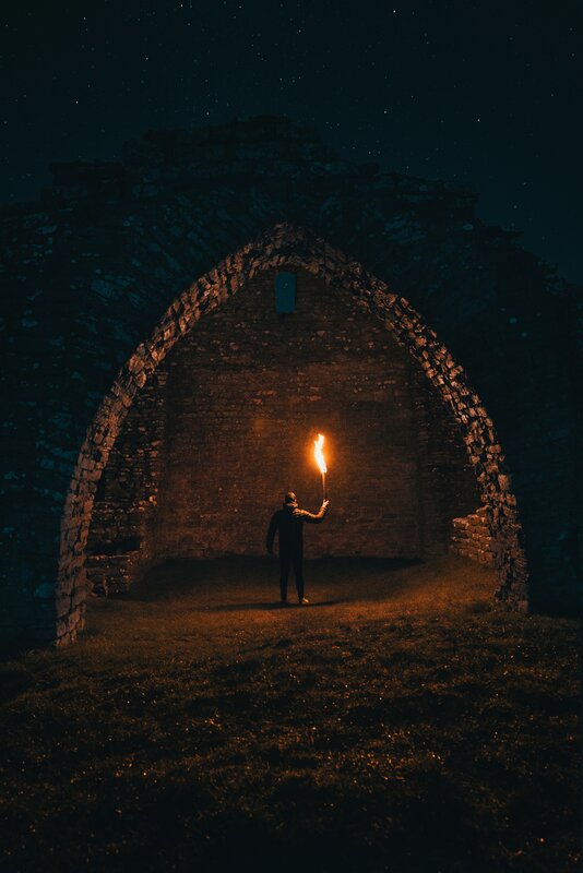Person Holding Torch — Black