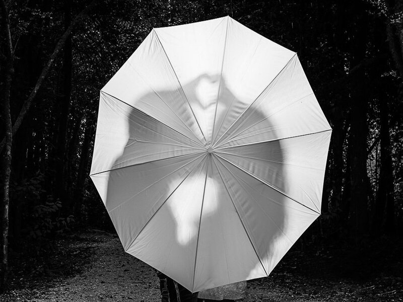 Person Holding Umbrella — Black, Dramatic