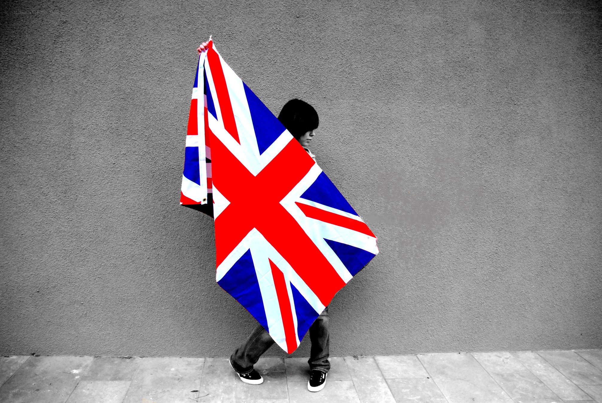 person holding union jack flag