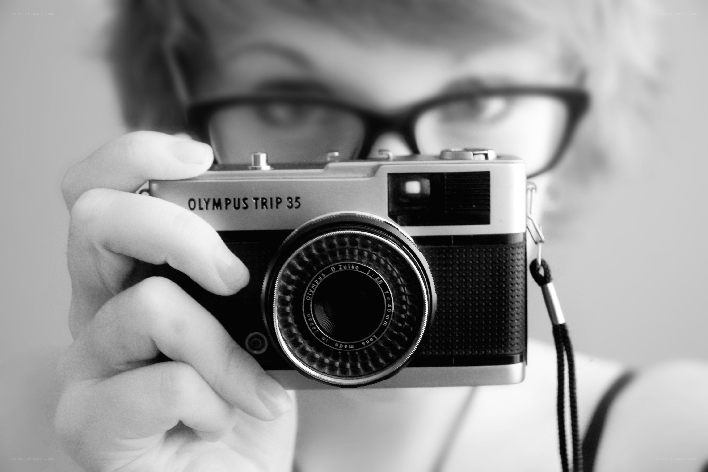 person holding vintage camera