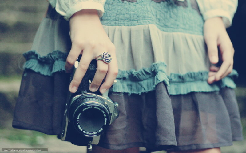 person holding vintage camera
