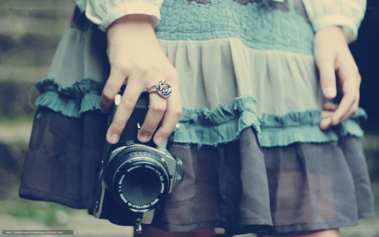 person holding vintage camera