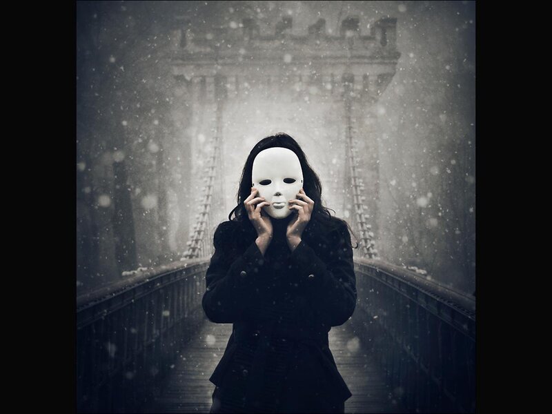 Person Holding White Mask — Black