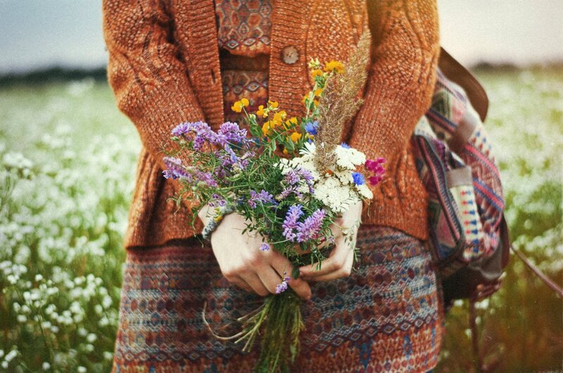 Person Holding Wildflowers — Orange