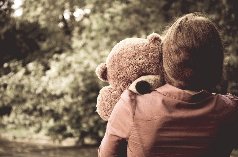 Person Hugging Teddy Bear