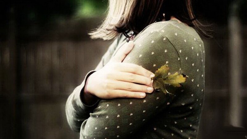 person hugging with leaf