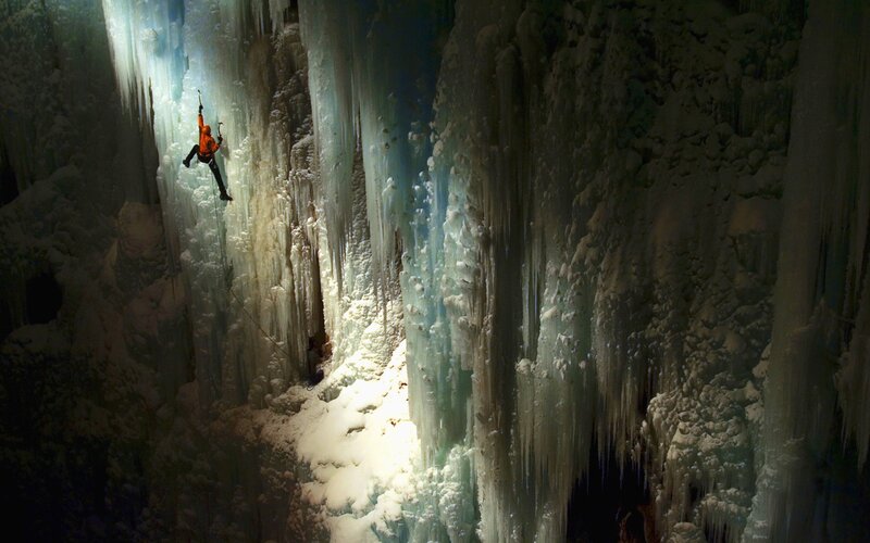 Person Ice Climbing — White, Dramatic