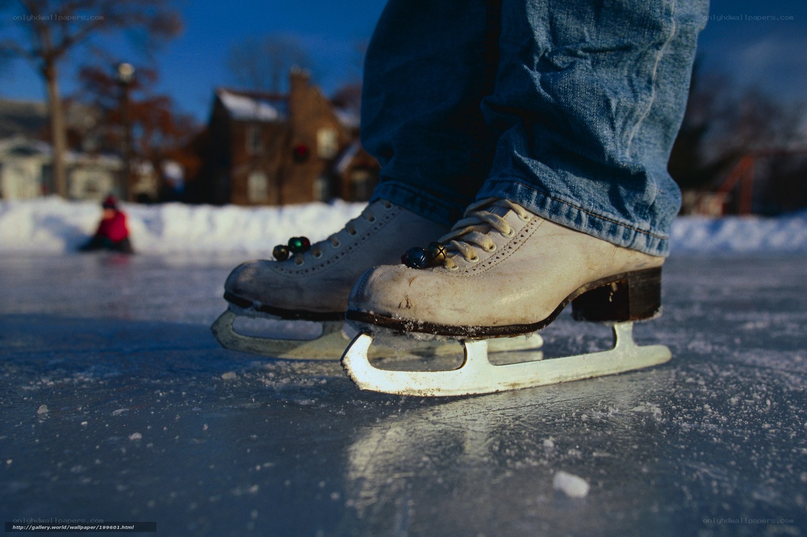 person ice skating on frozen pond