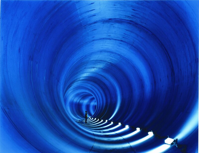 Person in a blue tunnel