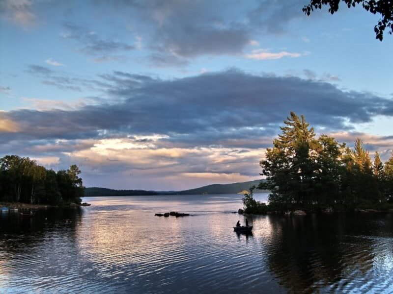 Person in a Boat — Blue, Serene, Sunset