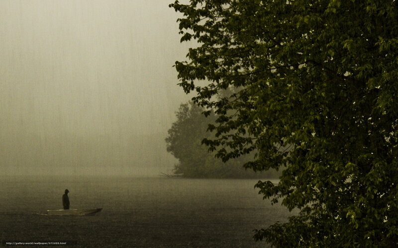 Person in a boat during a storm