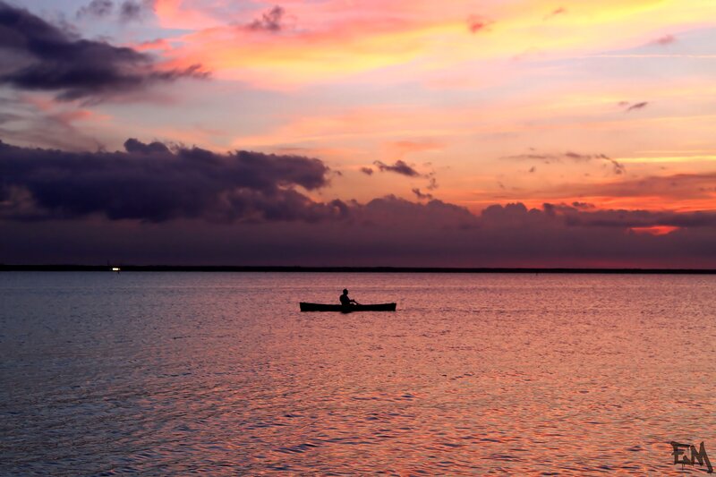 Person in a Canoe — Orange, Serene