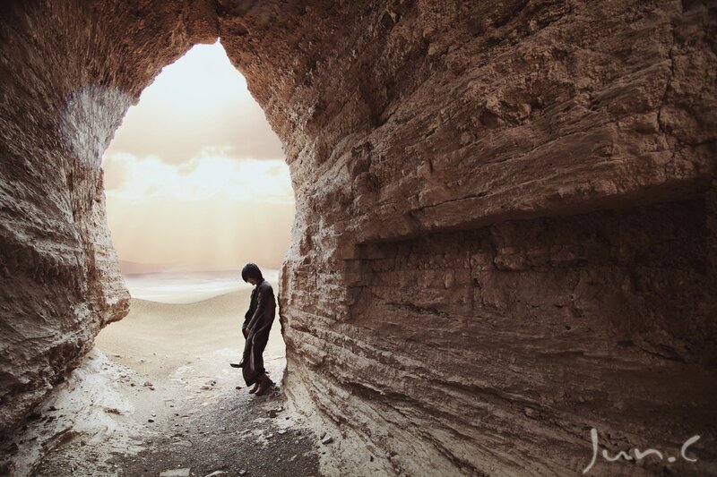 person in a cave looking out