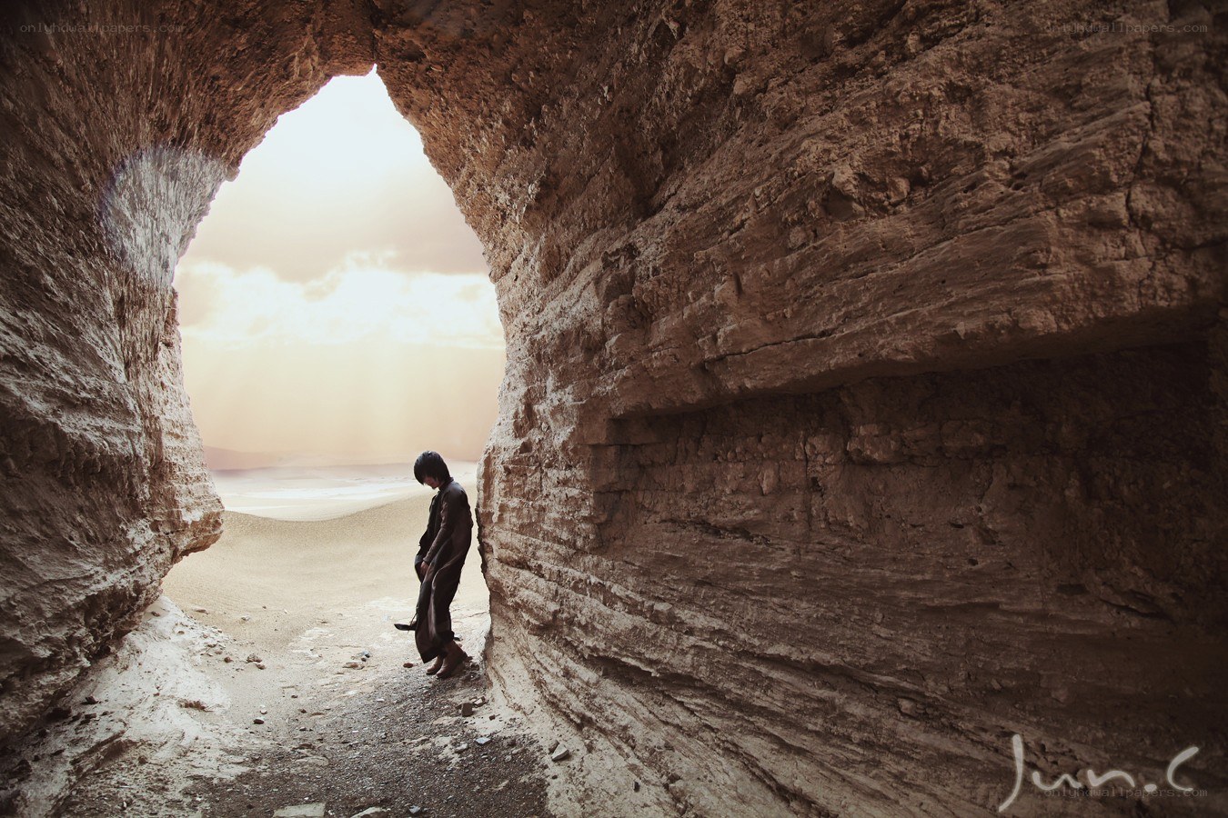 person in a cave looking out