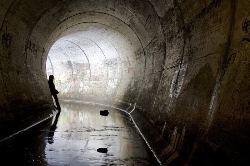Person in a concrete tunnel