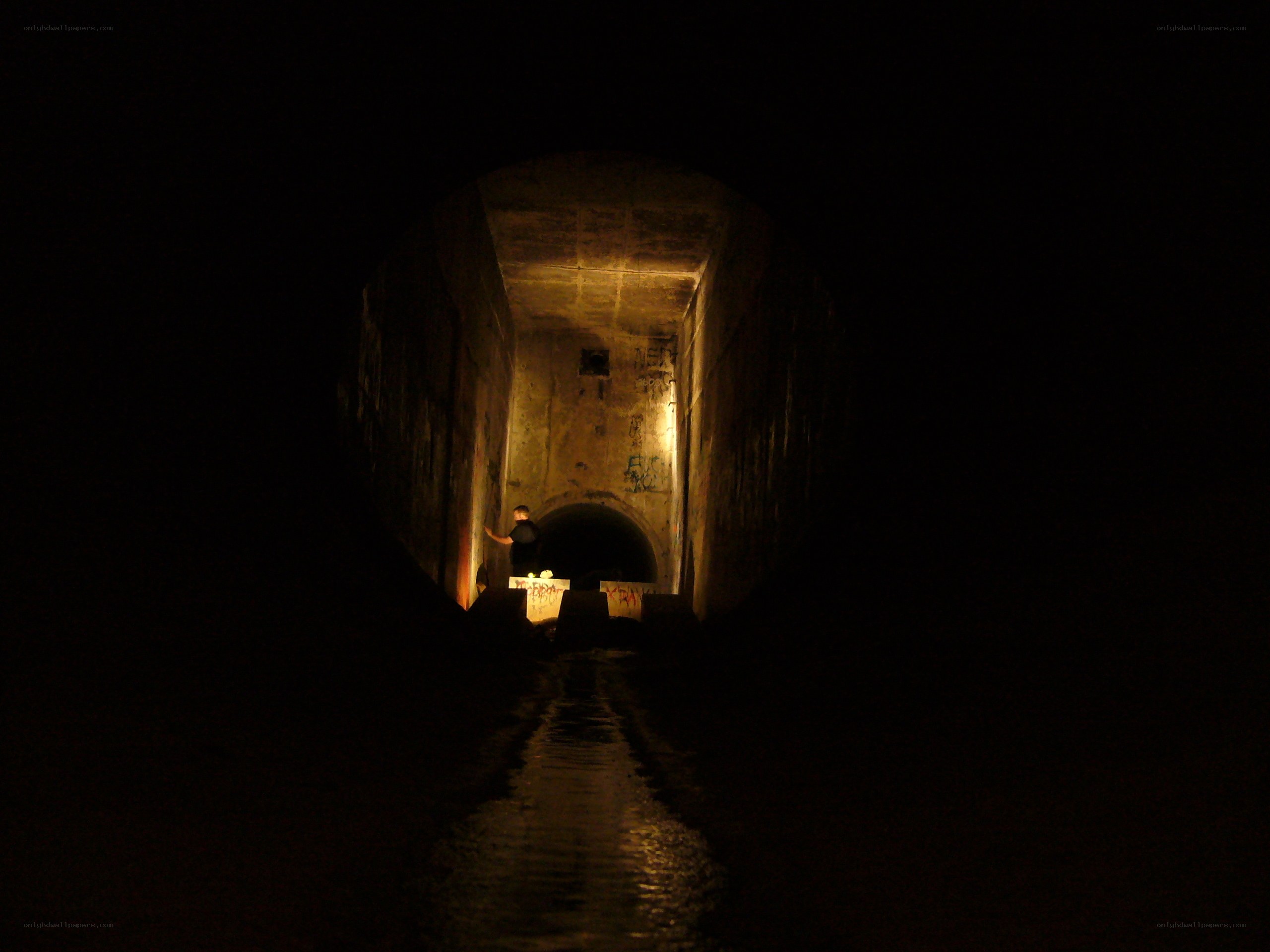 Person in a dark tunnel