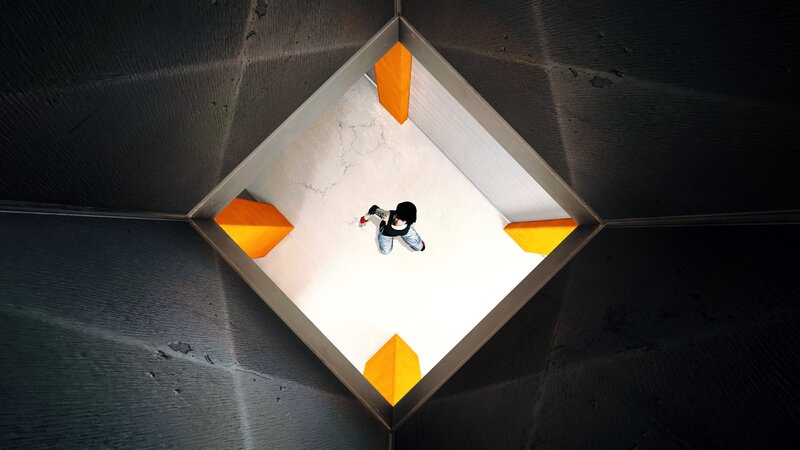person in a geometric room