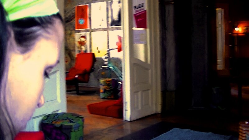 person in a room with red furniture