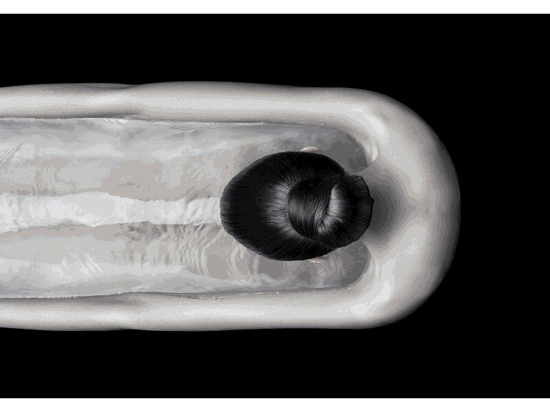 person in a transparent tube