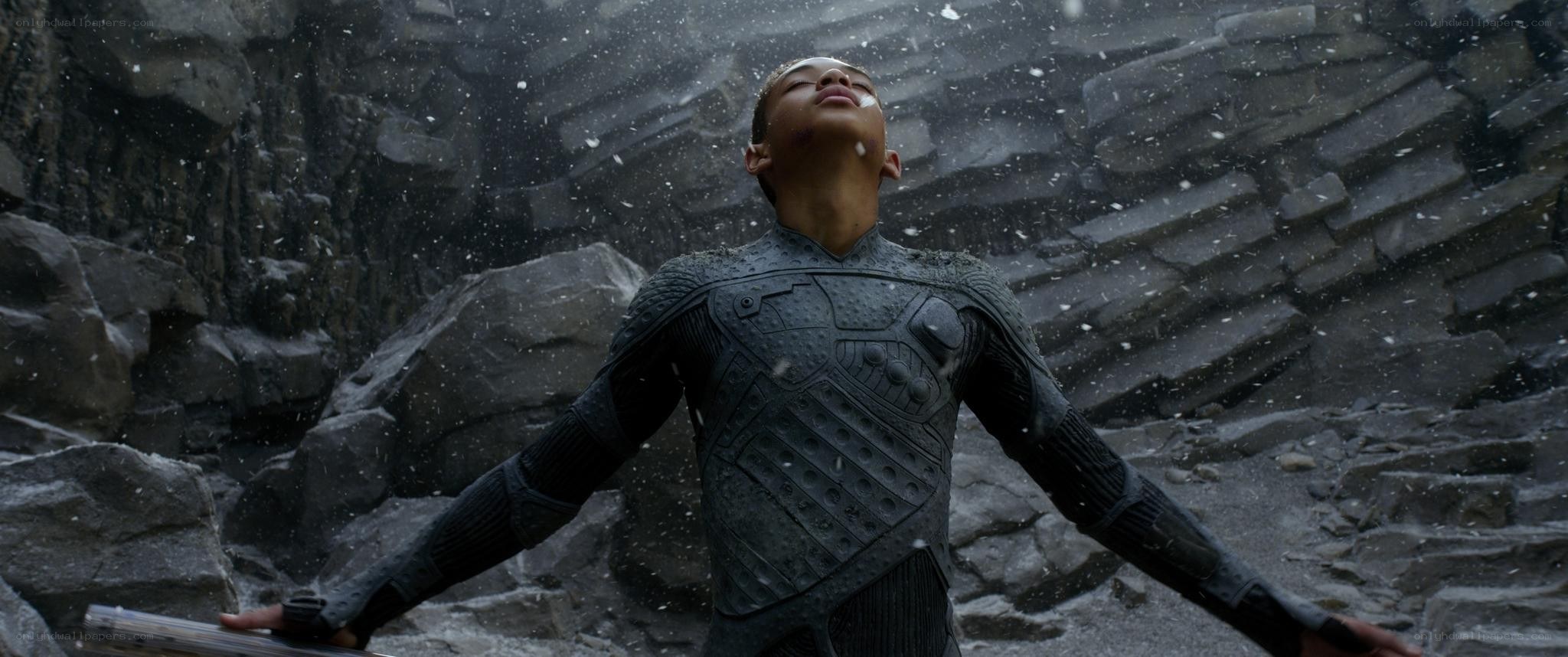 person in armor with arms outstretched